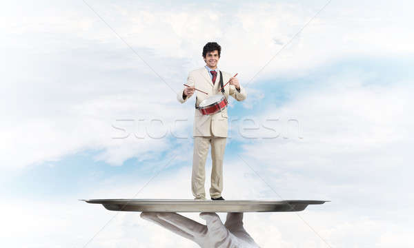 Fiatal üzletember fém tálca játszik dobok Stock fotó © adam121