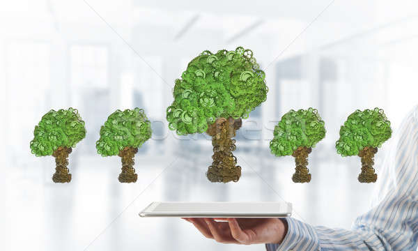 Eco green environment concept presented by tree as working mechanism or engine Stock photo © adam121