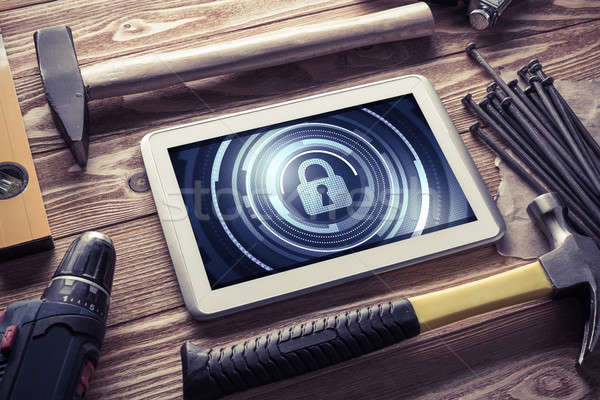 Stock photo: Web security and technology concept with tablet pc on wooden tab