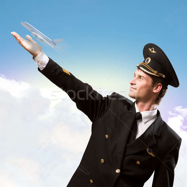 pilot in the form of extending a hand to airplane Stock photo © adam121