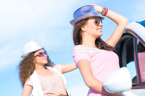 Two attractive young women wearing sunglasses Stock photo © adam121