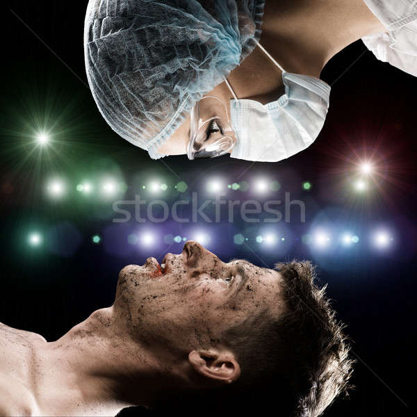 wounded man and the doctor Stock photo © adam121