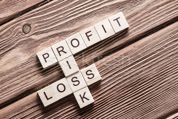 Profit loss and risk words on workplace collected of wooden cubes Stock photo © adam121