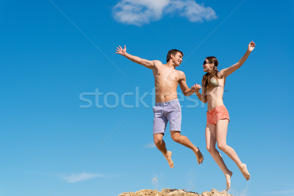 Stock photo: couple jumping together