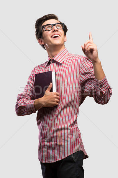 Mann angehoben Zeigefinger nachschlagen Papier Studenten Stock foto © adam121