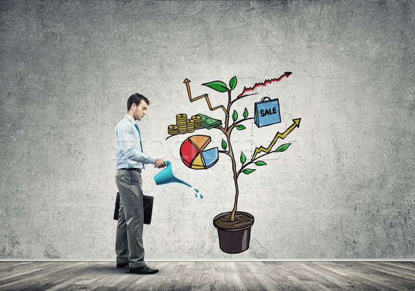 Young businessman in empty room watering drawn growth concept wi Stock photo © adam121