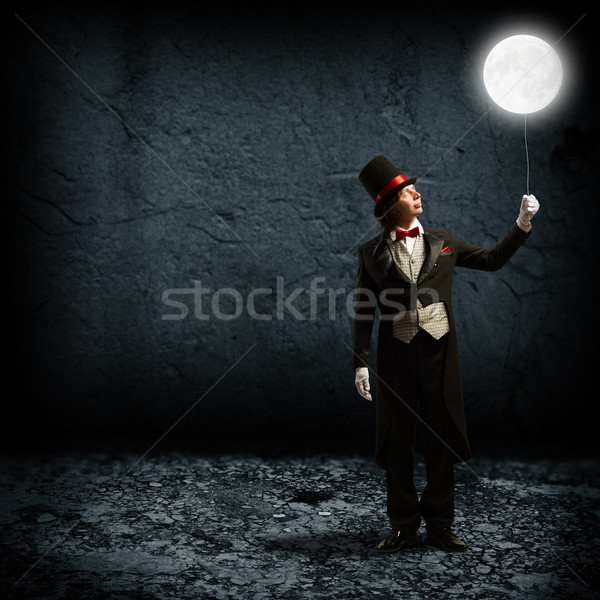 magician keeps the moon on a string Stock photo © adam121