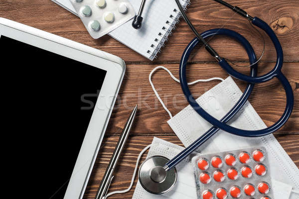 Stéthoscope médecins table en bois blanche comprimé [[stock_photo]] © adam121