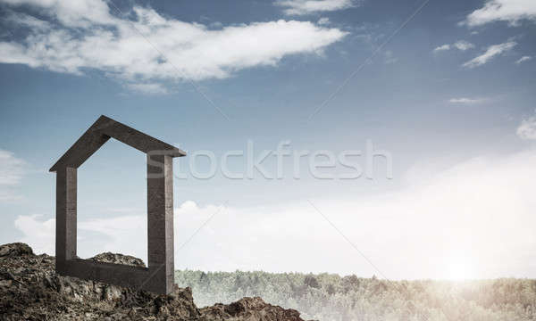 Conceptual image of concrete home sign on hill and natural lands Stock photo © adam121