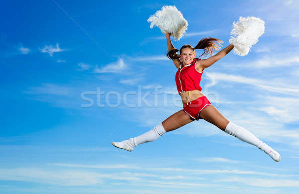 Tineri majoreta roşu costum jumping Blue Sky Imagine de stoc © adam121