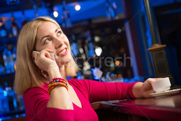 woman with a cup of coffee and cell phone Stock photo © adam121