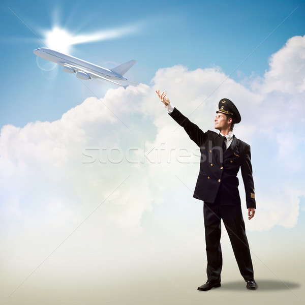 pilot in the form of extending a hand to airplane Stock photo © adam121