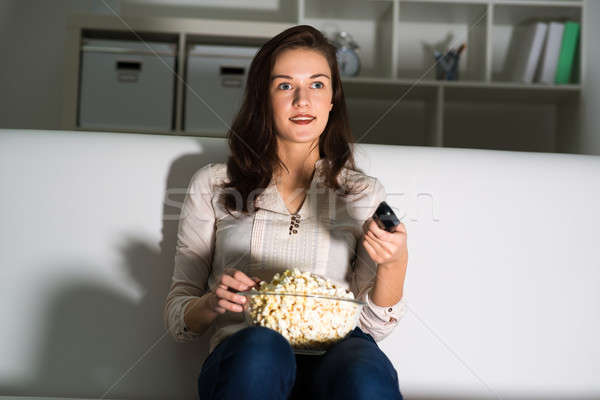 young woman watching TV Stock photo © adam121