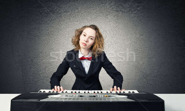 Mad woman play piano Stock photo © adam121