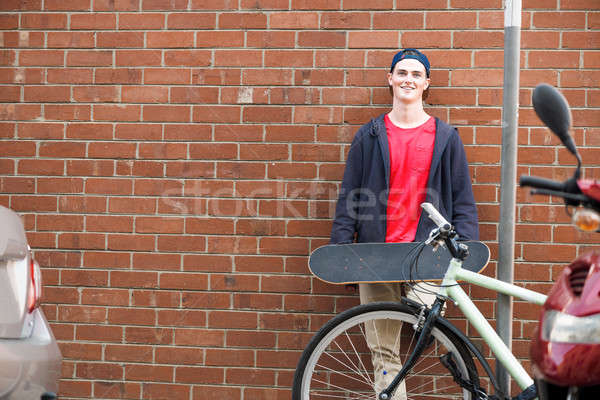 Handsome guy with skateboard Stock photo © adam121