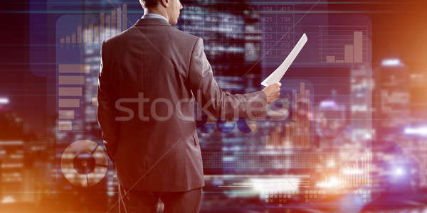 Stock photo: Digital background with infographs and man extending papers or contract