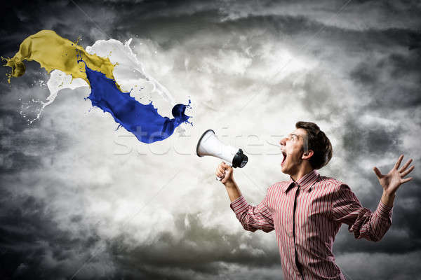 man yells into a megaphone Stock photo © adam121