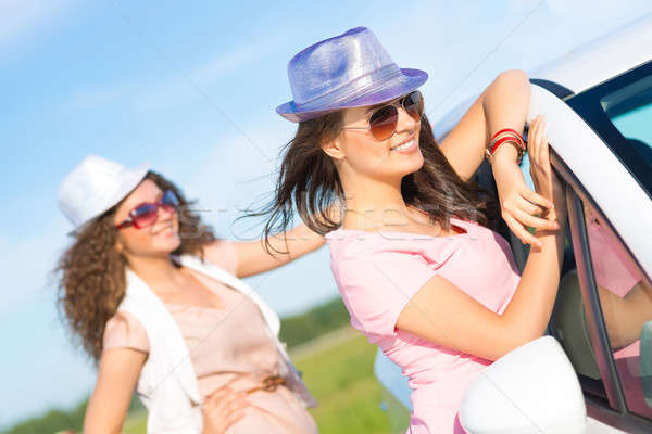 Two attractive young women wearing sunglasses Stock photo © adam121