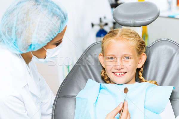 Dentist inspecting patient Stock photo © adam121