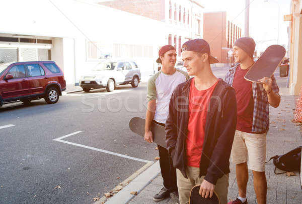 Stock photo: Guys skateboarders in street