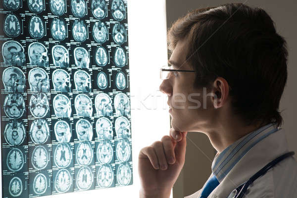male doctor looking at the x-ray image Stock photo © adam121