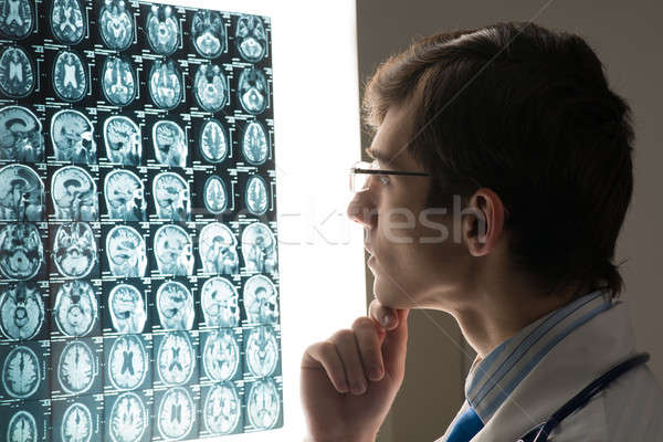 male doctor looking at the x-ray image Stock photo © adam121