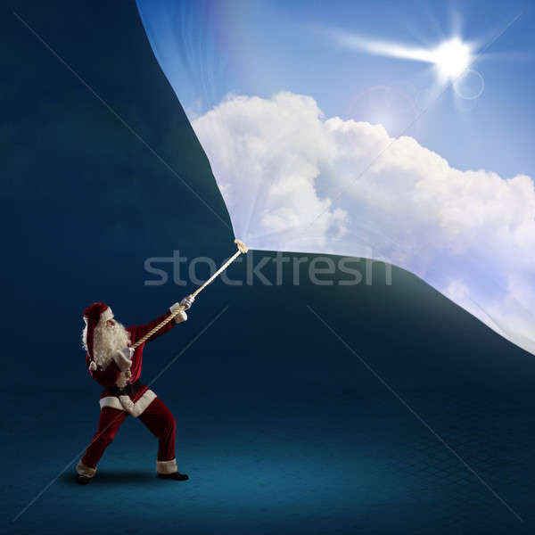 Santa Claus pulls the banner with day sky Stock photo © adam121