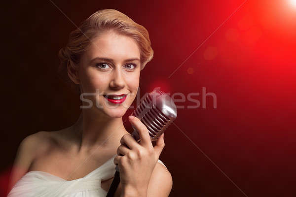 Vonzó nő énekes mikrofon mögött absztrakt divat Stock fotó © adam121