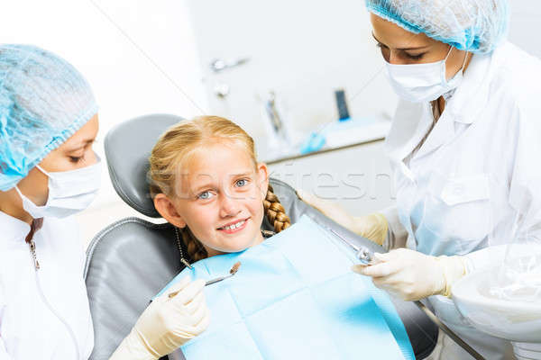 Dentist inspecting patient Stock photo © adam121