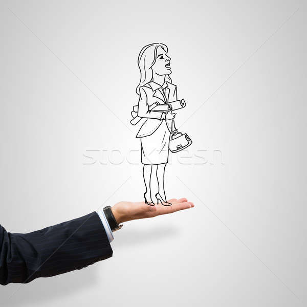 Caricatures of businesswoman in palm Stock photo © adam121
