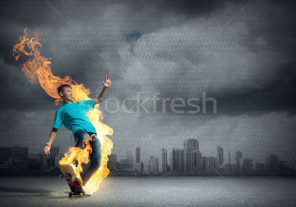 Stock photo: Teenager boy on skate