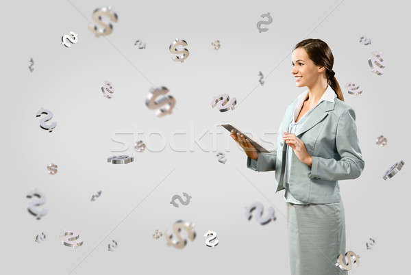 business woman smiling and holding a table Stock photo © adam121