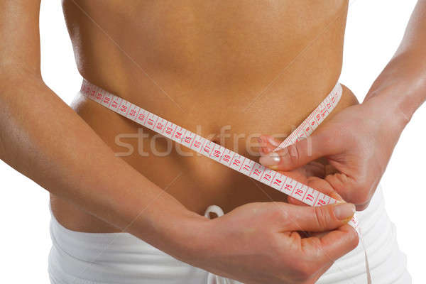 young athletic woman measuring waist Stock photo © adam121