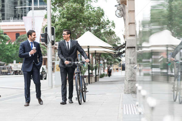 Kettő üzletemberek séta beszél sétál bicikli Stock fotó © adam121