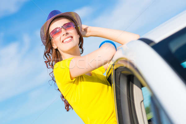 Young woman got out of car window Stock photo © adam121