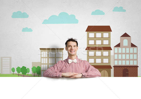 Cheerful man with banner Stock photo © adam121