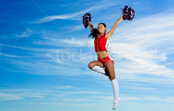 Jeunes cheerleader rouge costume sautant ciel bleu [[stock_photo]] © adam121