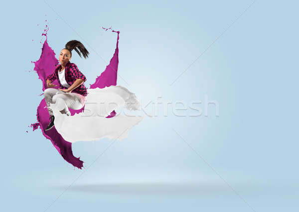 young female dancer jumping with splash of paint Stock photo © adam121
