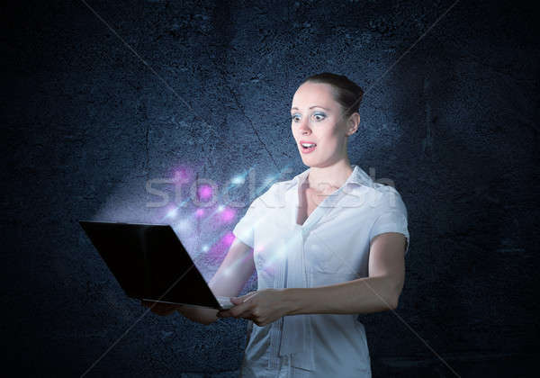 young attractive woman holding a laptop Stock photo © adam121
