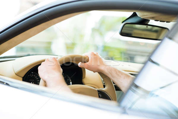 male hand holding a car wheel Stock photo © adam121