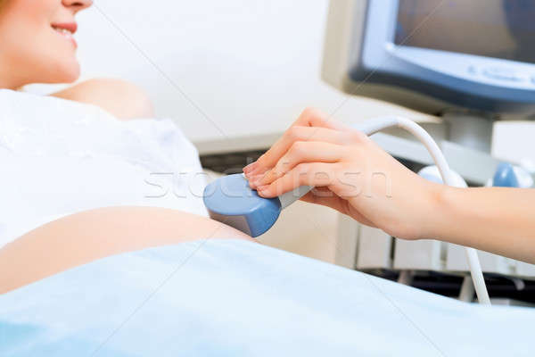 close-up of hands and abdominal ultrasound scanner Stock photo © adam121