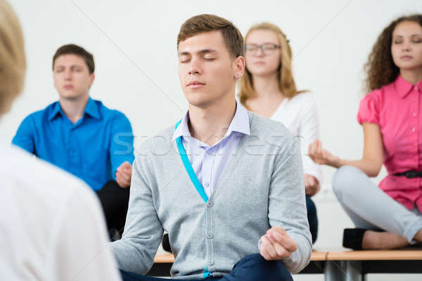 Stock photo: group of young people meditating