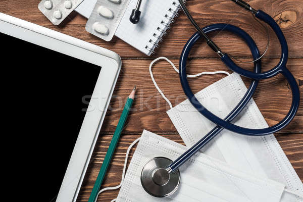 Stéthoscope médecins table en bois blanche comprimé [[stock_photo]] © adam121