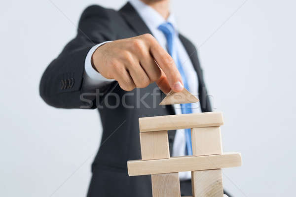 Businessman making tower Stock photo © adam121