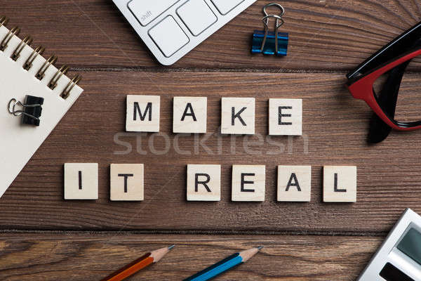 Motivation conceptual phrase collected of wooden blocks on business workplace Stock photo © adam121