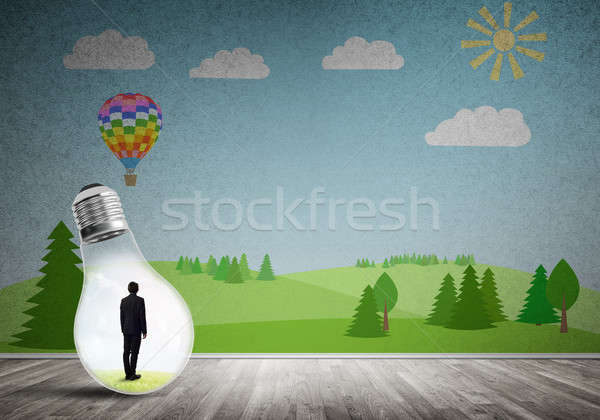 Businessman trapped in bulb Stock photo © adam121