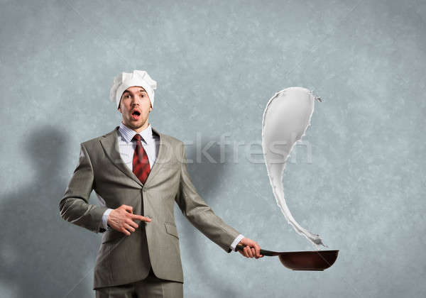 Businessman with pan Stock photo © adam121