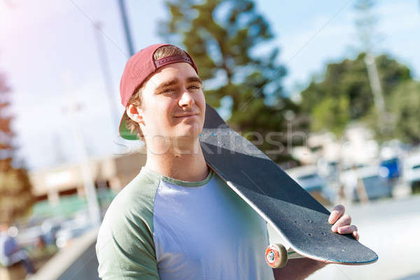 Handsome guy with skateboard Stock photo © adam121