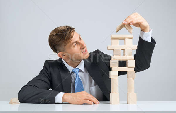 Businessman making tower Stock photo © adam121