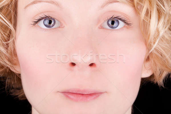 Pretty blond girl's face with blue eyes Stock photo © aetb